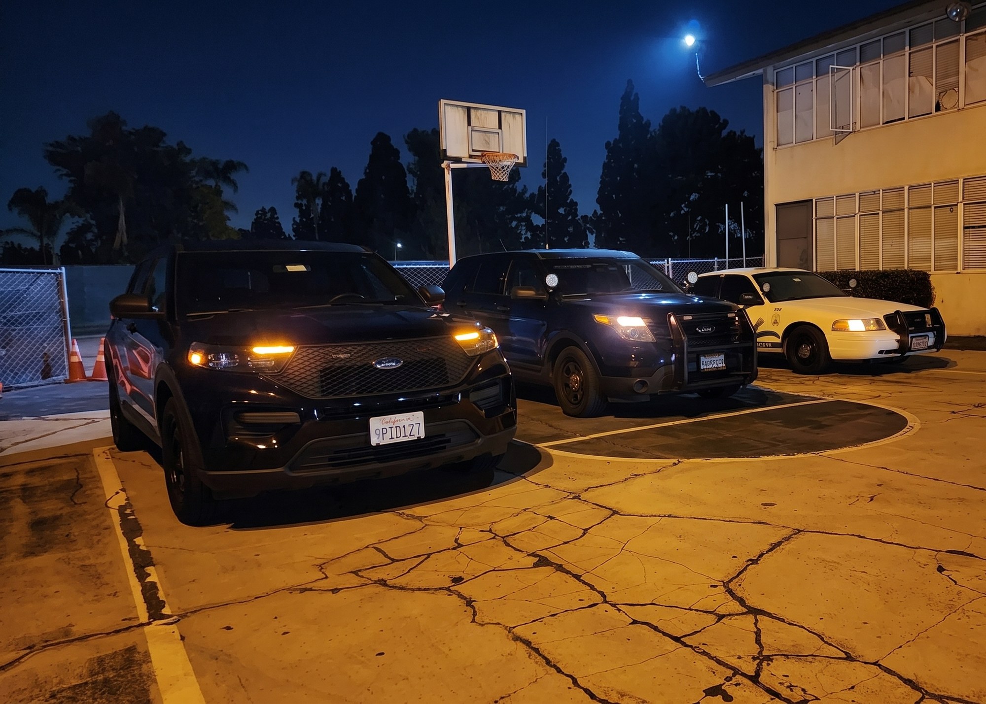 Global One Security marked and unmarked patrol vehicles staged and ready for night patrol
