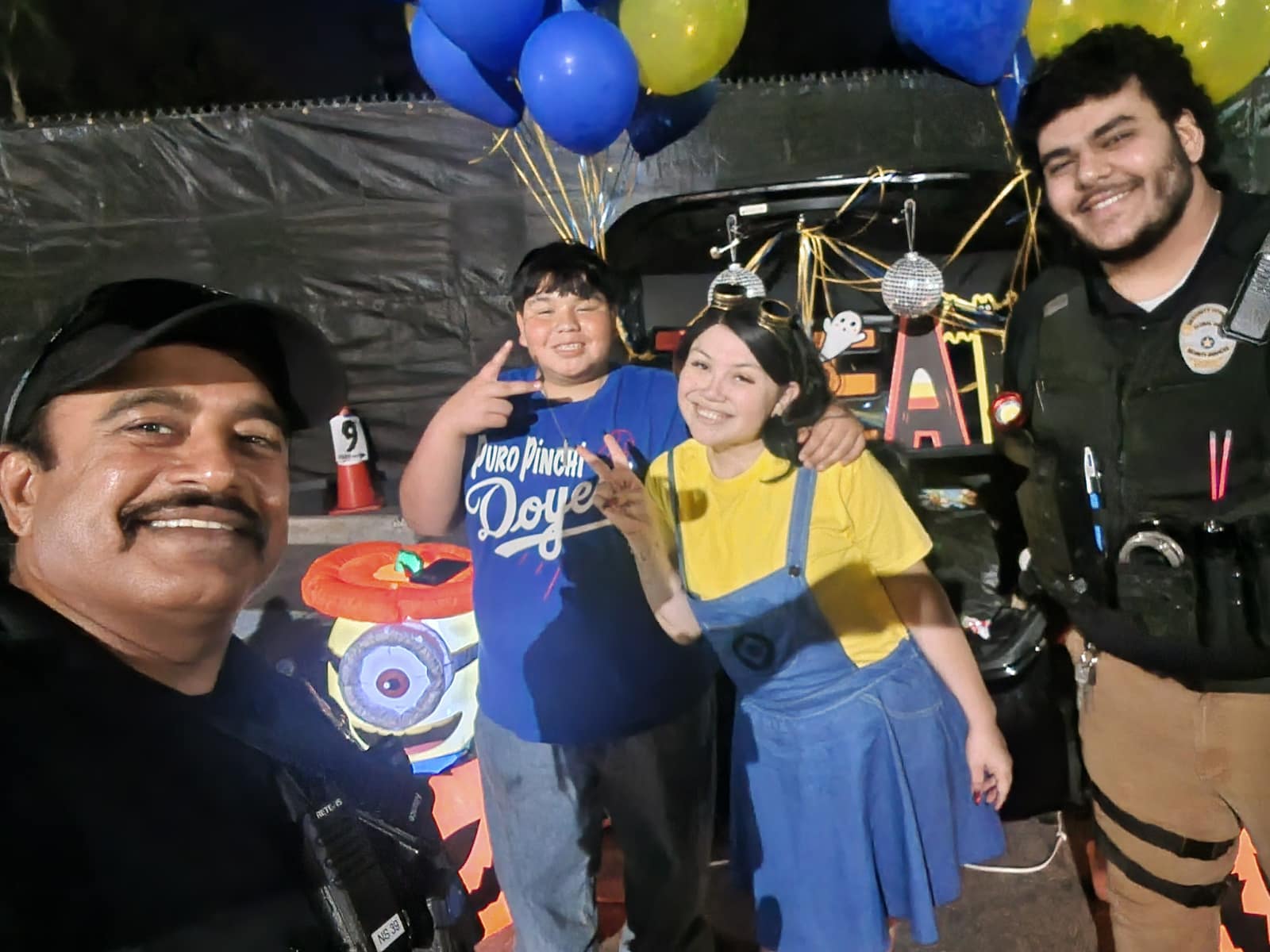 Officers with families at a fall festival