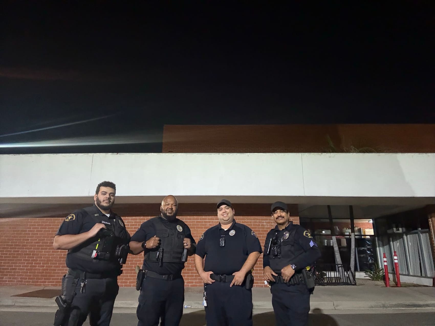 Officers together after a shift briefing